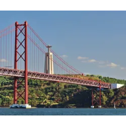 Monument of Faith and Panoramic BeautyCristo Rei, located in Almada, on the south bank of the Tagus River, is one of the most iconic tourist attractions in Portugal. Inspired by Christ the Redeemer in Rio de Janeiro, the monument attracts visitors from all over the world thanks to its grandeur and the spectacular view of Lisbon it offers.
History and Symbolism
Opened in 1959, Cristo Rei was built as a vote of gratitude for Portugal being spared the direct horrors of World War II. The idea for its creation arose in 1934, after the cardinal-patriarch of Lisbon, Dom Manuel Gonçalves Cerejeira, visited Brazil and was impressed by Christ the Redeemer.
At 110 meters high, including the statue of Christ and the pedestal, the monument is one of the largest buildings in the country. The statue with open arms, designed by sculptor Francisco Franco de Sousa, symbolizes peace and welcome, while the chapel at the base is dedicated to the Sacred Heart of Jesus, reinforcing the spiritual value of the place.
Cultural and Religious Landmark
In addition to being a tourist destination, Cristo Rei is a point of religious pilgrimage. Its majestic presence in the landscape of Almada makes it a symbol of faith, gratitude and an invitation to contemplate the beauty and history of Portugal.